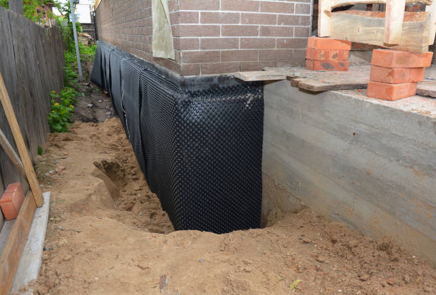 SJ Waterproofing Pros technician performing targeted Emergency Waterproofing assessment in Walworth, NY